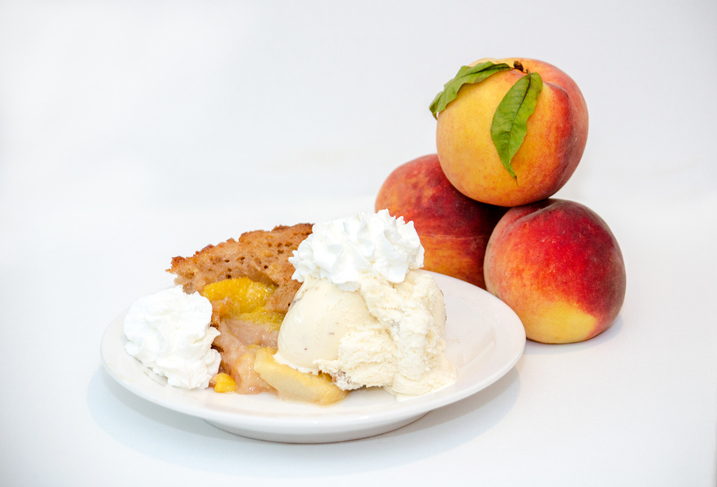 Sweet Peach Cobbler With Ice Cream And Whipped Cream