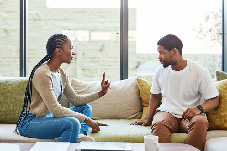 Shot of a young couple having a disagreement at home