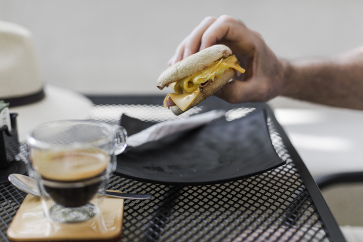 English muffin with eggs and an espresso