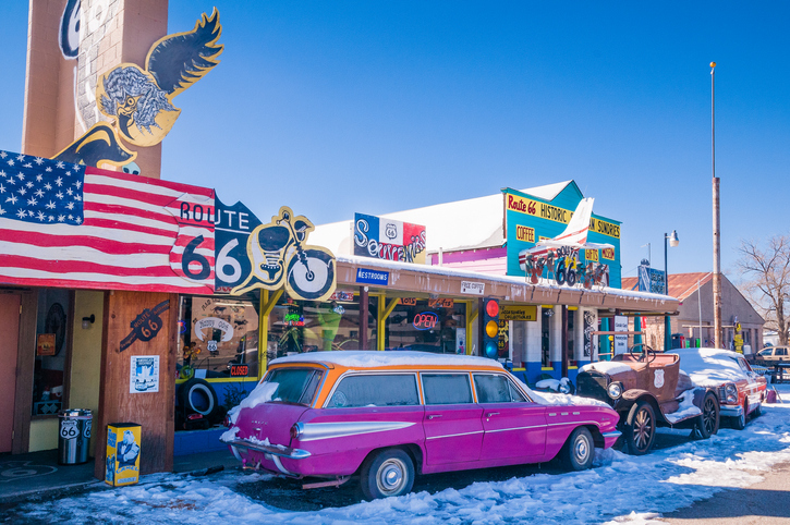 Storefronts, old car and Route 66 paraphernalia in Seligman