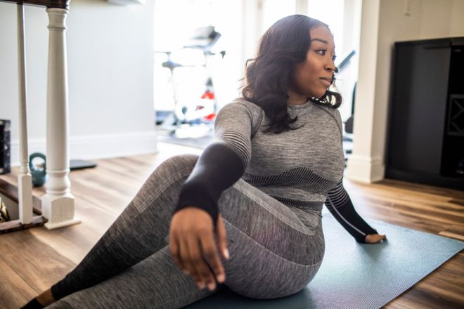 Woman stretching in gym