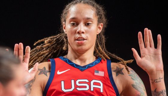Brittney Griner throws her hands up while playing at the The Olympic Games in Tokyo 2020.