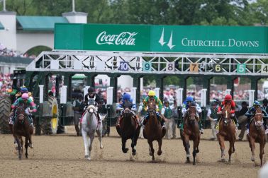 Horses break from the gate in the Believe You Can fourth race of the of Kentucky Oaks Day.