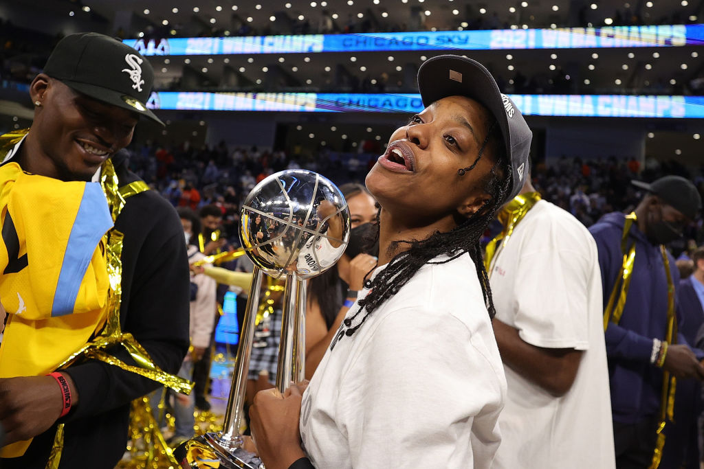 Diamond DeShields holds the WNBA Finals trophy during game four.