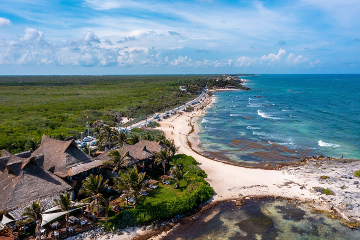 Aerial Tulum Coastline By The Beach With A Magical Caribbean Sea And Small Huts By The Coast. honeymoon destination