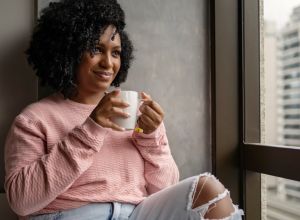 African American woman thinking of ways to stay positive
