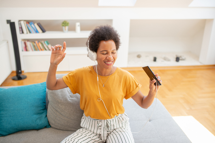 Portrait of a beautiful mid adult woman listening to music