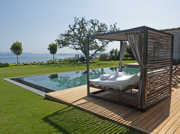 Outdoor swimming pool and Wood bed - chair near the pool