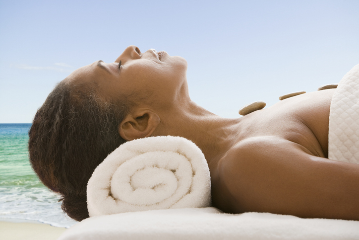 Mixed race woman enjoying one of the best luxury spa experiences