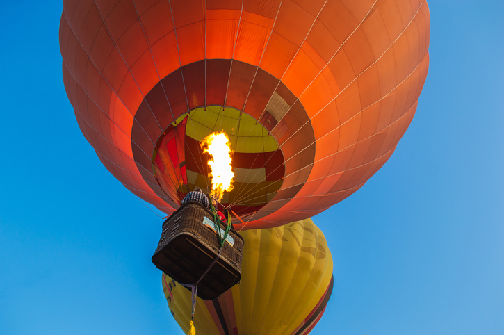 Colorful hot air balloon flying in the blue sky