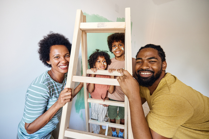 Happy black family during home renovation process.