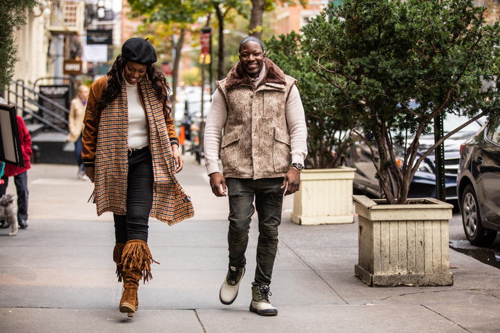 Millennial couple walking in Soho - New York