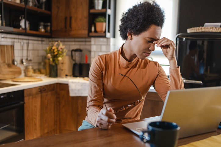 African-American woman having a stressful day while working from home