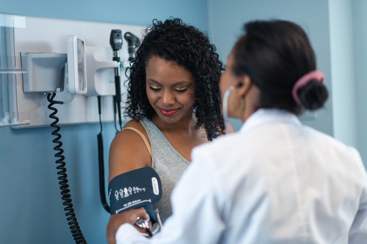 Young woman in medical consultation with female doctor