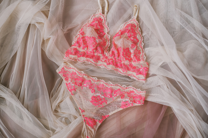Erotic lace underwear set on tulle fabric.