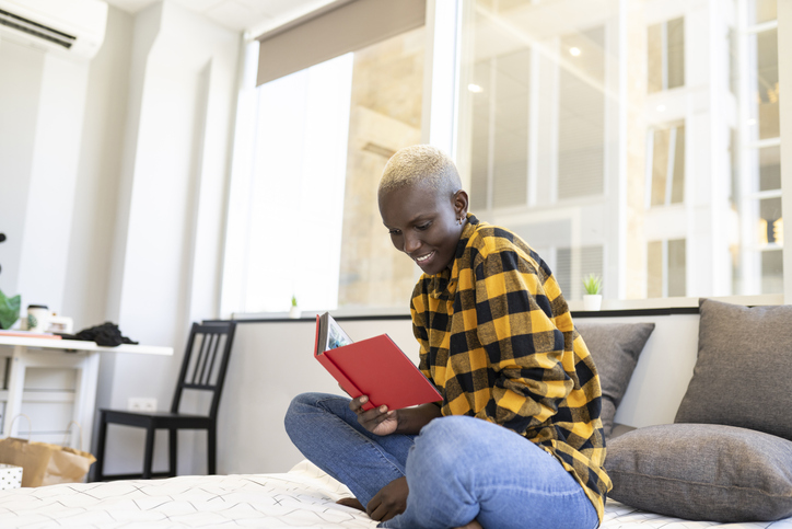 woman reading books by black bisexual authors