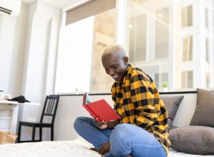 woman reading books by black bisexual authors