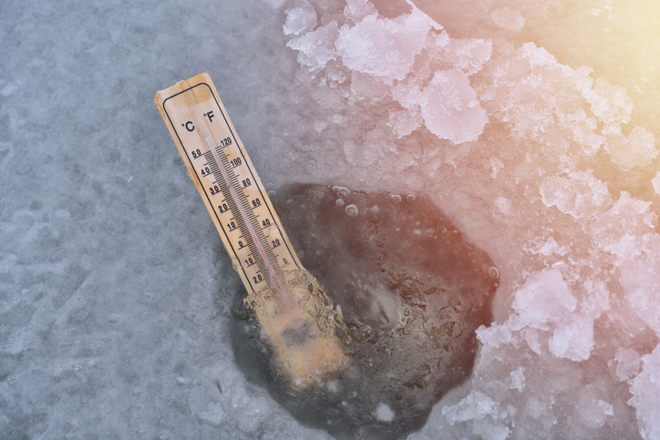 Directly Above Shot Of Thermometer In Ice