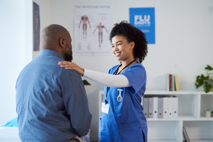 Medical healthcare, communication and support from doctor during a consultation with a patient at hospital. Clinic nurse with smile and care while consulting with African man about cardiology results