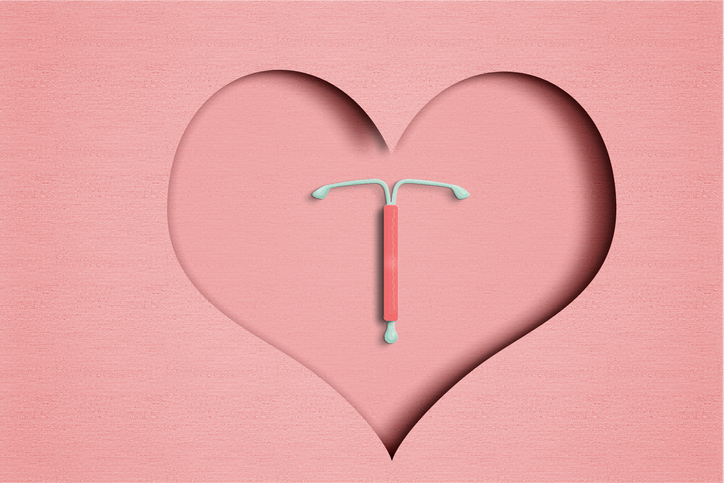 IUD.Concept hormonal contraception on a pink background