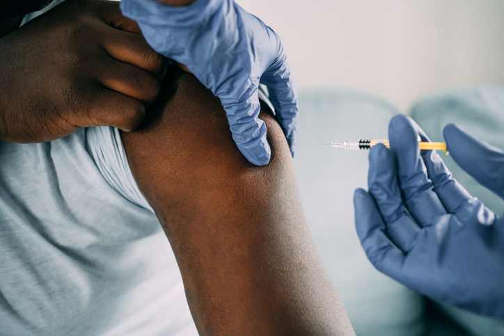 Young man getting vaccinated.