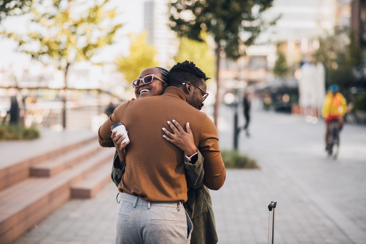 Lovely young black couple hugging