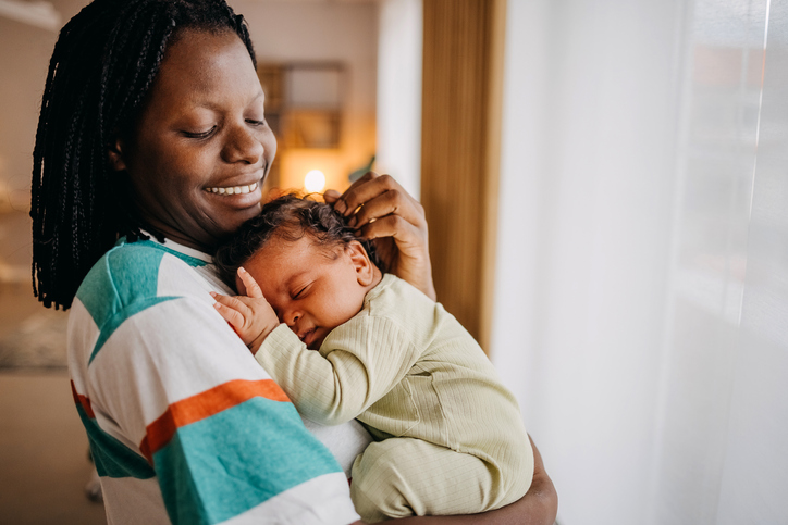 Loving mom holding her baby