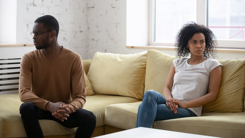 Upset wife feeling guilty after quarrel with African American husband considering how to take a break in a relationship