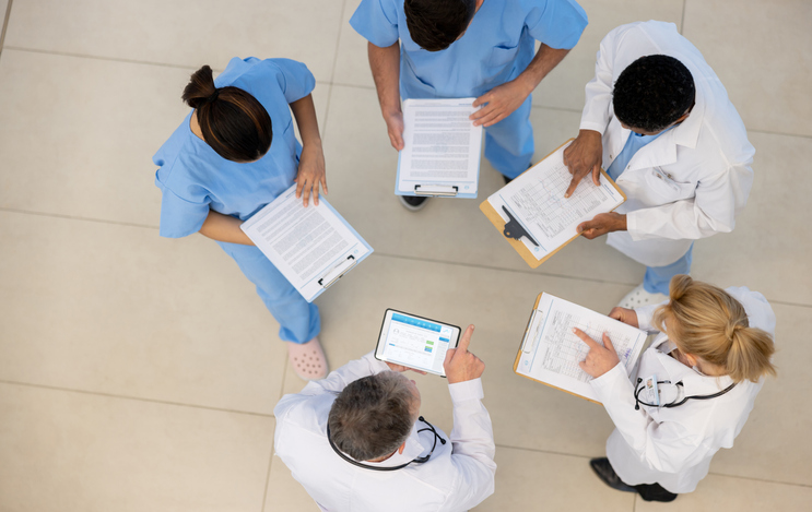 Group of doctors talking at the hospital