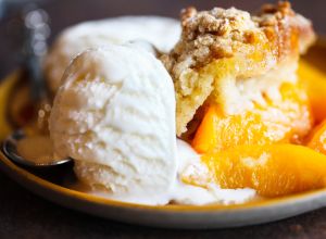 Drop biscuit peach cobbler with melting ice cream
