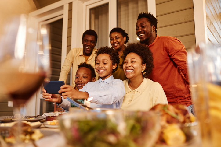 Black Family Taking Selfie Photo at Dinner
