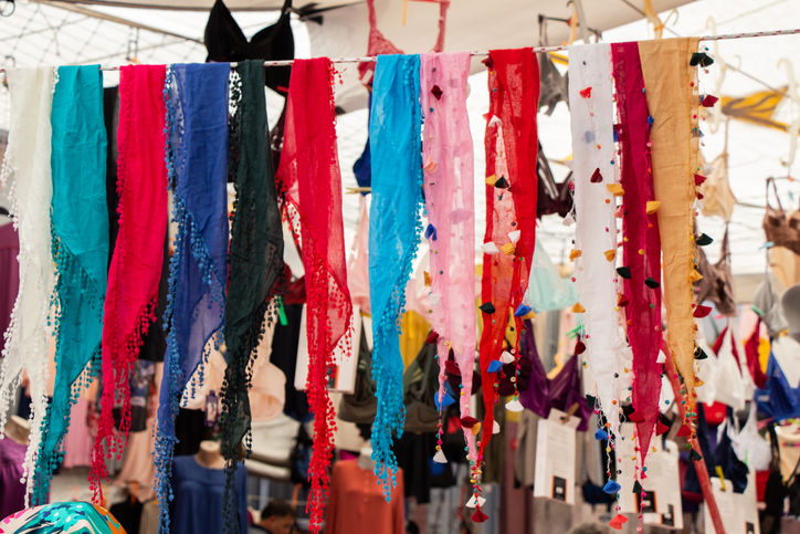 Closeup shot of colorful scarfs hanging in the market for sale