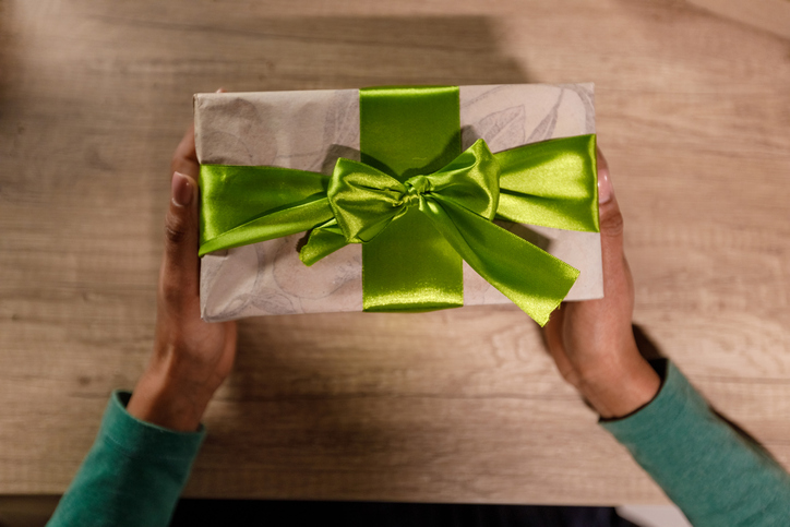 Directly above shot of a present with green ribbon