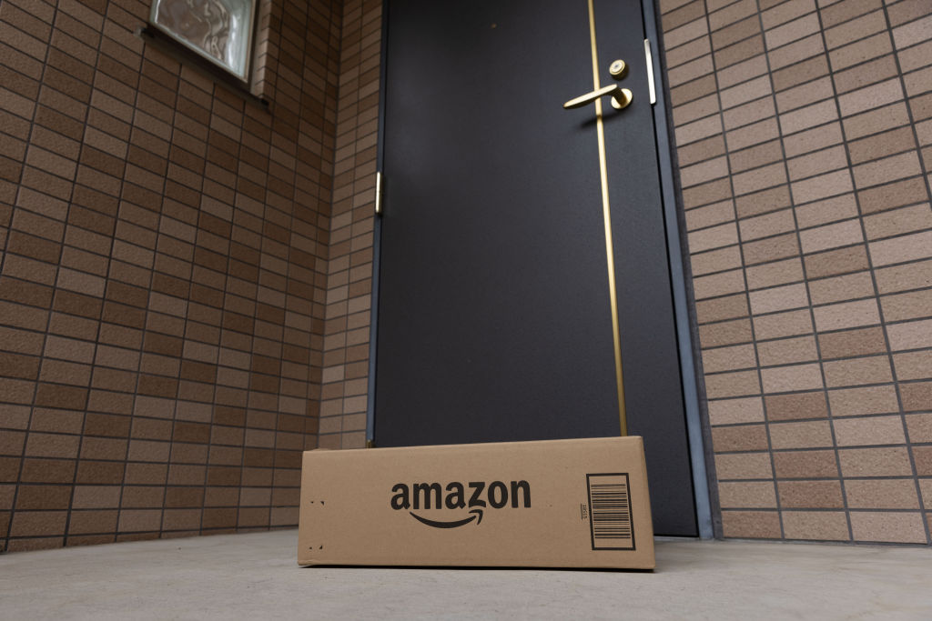 Amazon delivery package seen in front of a door...