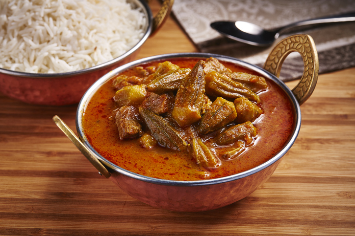 Okra Stew with white rice Khoresht Bamia or lady finger curry served in dish isolated on table side view of middle east food