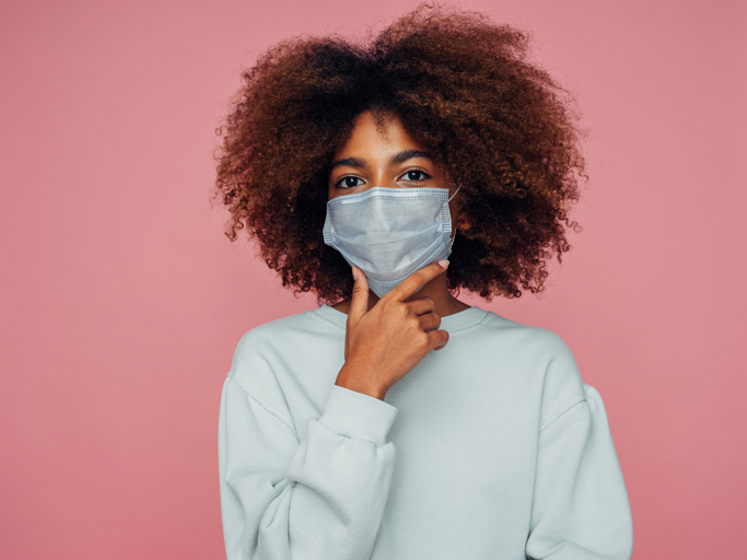 Afro girl in protective mask worried about health insurance
