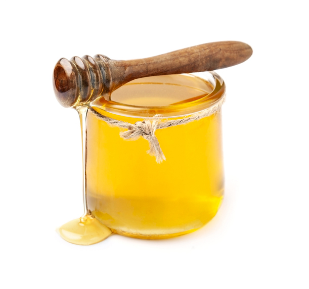 Close-up of honey in jar on white background,Moldova