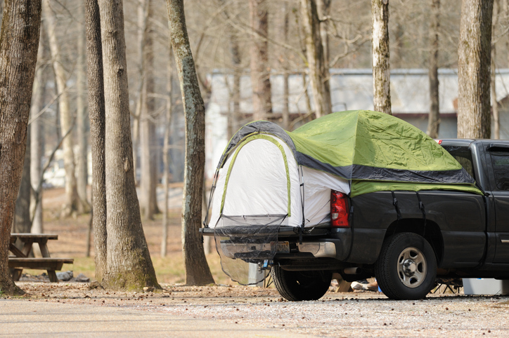 Pickup truck bed tent in campground