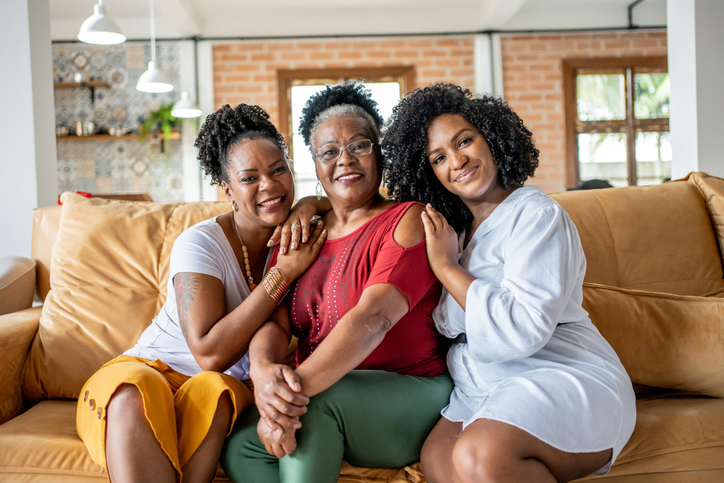 Portrait of mother with her daughters at Christmas