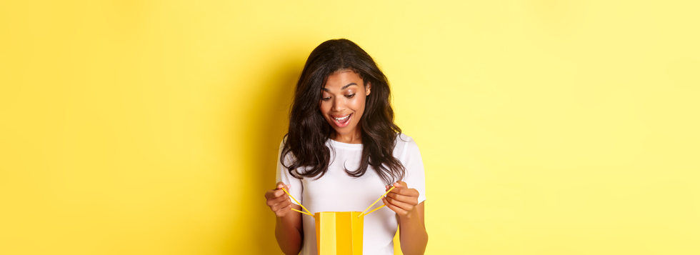 Image of happy and surprised african-american girl,Receiving a gift