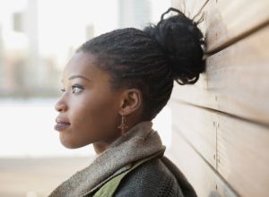 Side view of thoughtful woman outdoors thinking about finding your purpose