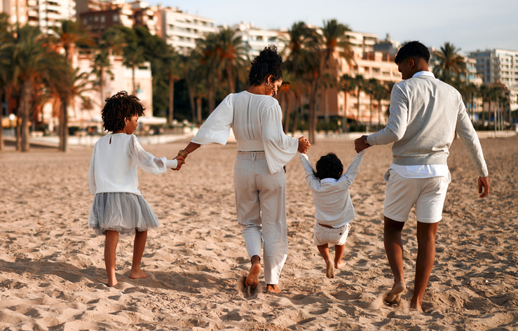 African American family on the beach on the weekend