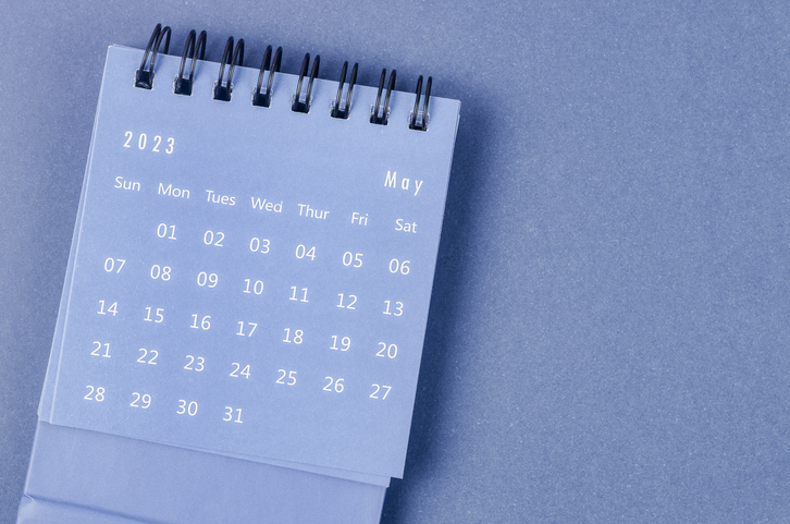 The May 2023 Monthly desk calendar for 2023 year on blue background.