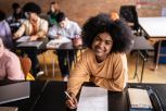 Portrait of a young woman doing a educational test in the classroom