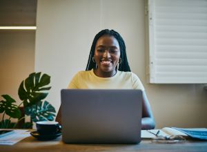 Laptop, working and black woman on laptop taking free black history courses