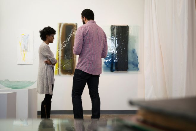 Couple admiring art in gallery
