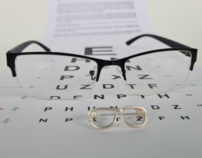 Black glasses and an ophthalmologist's table for checking eyesight