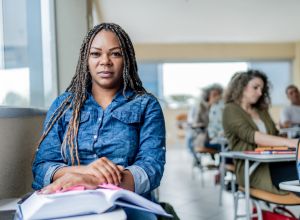 Portrait of adult black female student in classroom