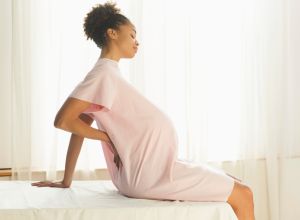 Pregnant woman waiting for her doctor to discuss Black maternal health