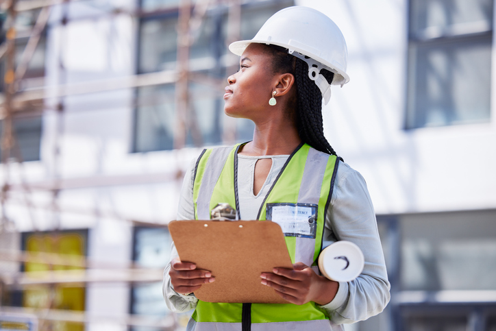 Architecture, checklist and project management with black woman at construction site for civil engineering, designer and building inspection. Industrial, vision and planning with construction worker